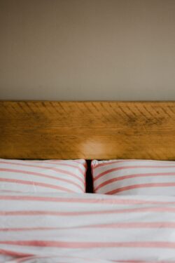 bedroom pillows headboard bedding interior design home decor minimalist cozy morning soft hygge lines neutral comfort sleep