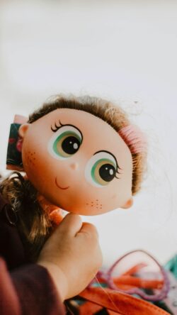 big eyes doll kawaii aesthetic toy face character design cute figurine pastel colors childhood portrait playful decor stylized art doll photography soft lighting whimsical