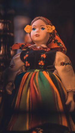 traditional folk doll ethnic costume cultural heritage vintage handicraft doll collector textile details poland culture eastern europe folk art ornamental dress historical toys aesthetic portrait