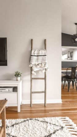 interior ladder blanket scandi home decor living room white wall cozy textile nordic design wooden furniture modern simple