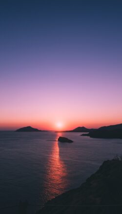 sunset ocean sea islands silhouette horizon purple pink orange dramatic nature travel cliffs view coast
