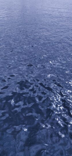 water wave texture ocean sea blue deep minimal abstract surface reflection nature ripples dark monochromatic