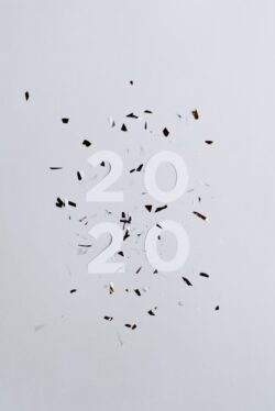 2020 newyear confetti minimal whitebackground celebration graphic design simple numbers flatlay party event clean