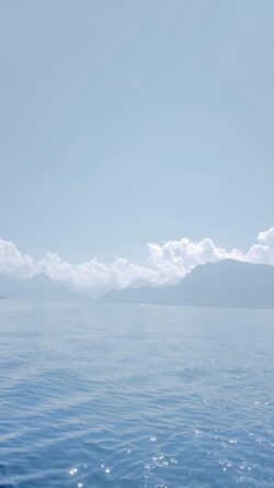 sea mountains ocean coast blue mist horizon nature scenery peaceful vacation travel island water cloudy