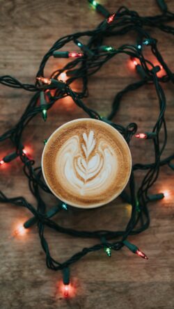 latte art coffee cup christmas lights festive holiday vibe winter cozy mood night aesthetic warm atmosphere fairy lights wallpaper