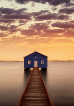 blue boat house pier wooden dock calm water sunset clouds symmetry minimalism swan river perth australia architecture serenity tranquil