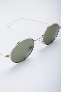 sunglasses round frames fashion accessory vintage style eyewear shades minimal product photography retro gold frame summer style trendy clean white